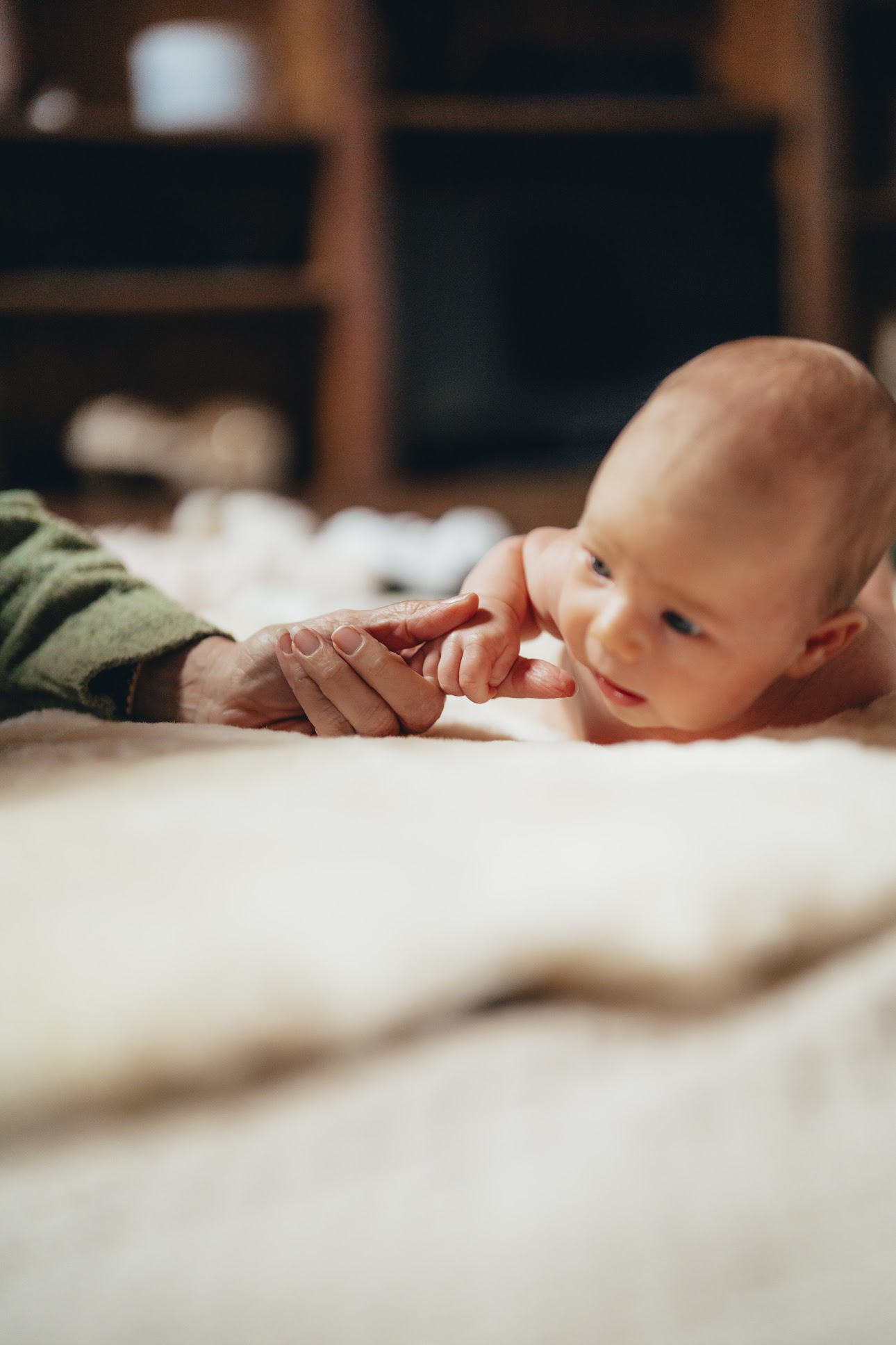 Summer's hand wrapped around her grandmother's finger
